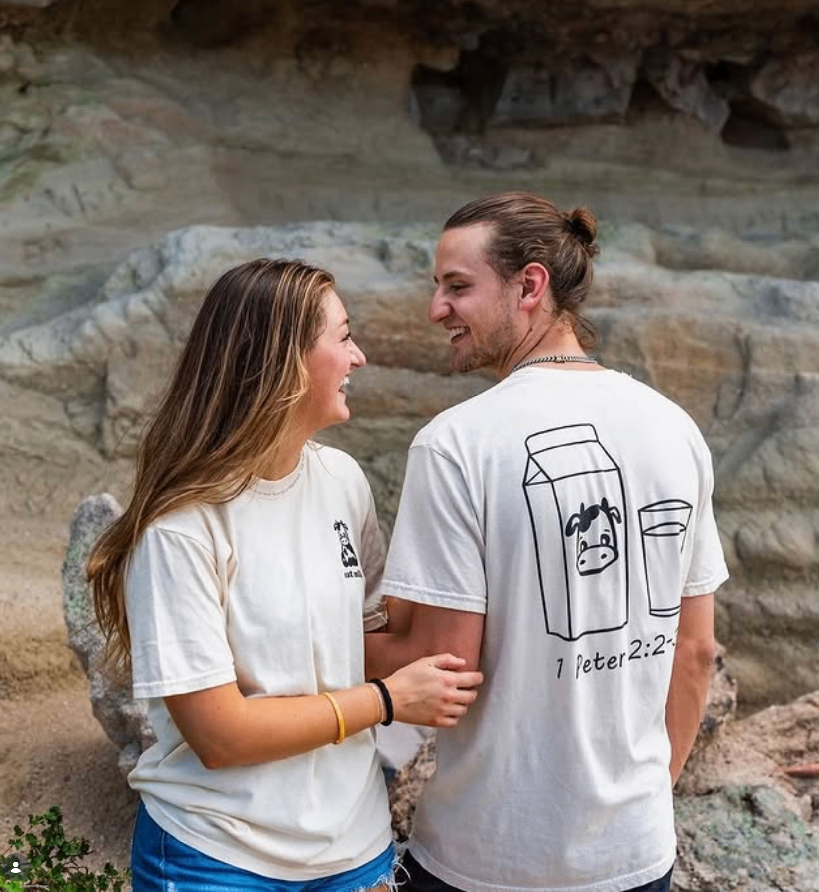 Couple laughing in matching custom t-shirts
